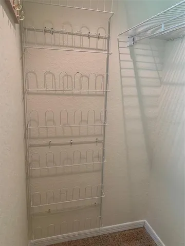 a view of a backyard with furniture and a garden