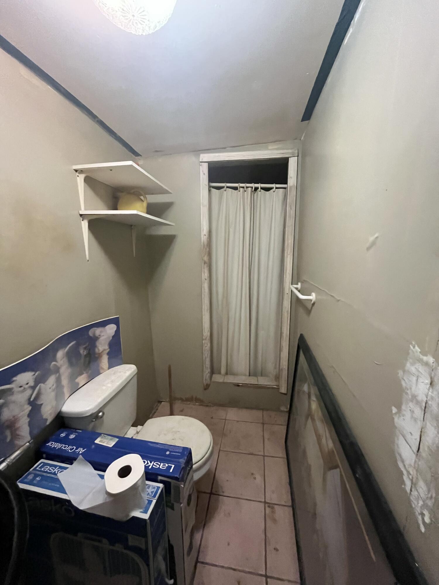 907 Virginia Street Key West, FL 33040 - Photo 17 of 19 a bathroom with a sink and a mirror