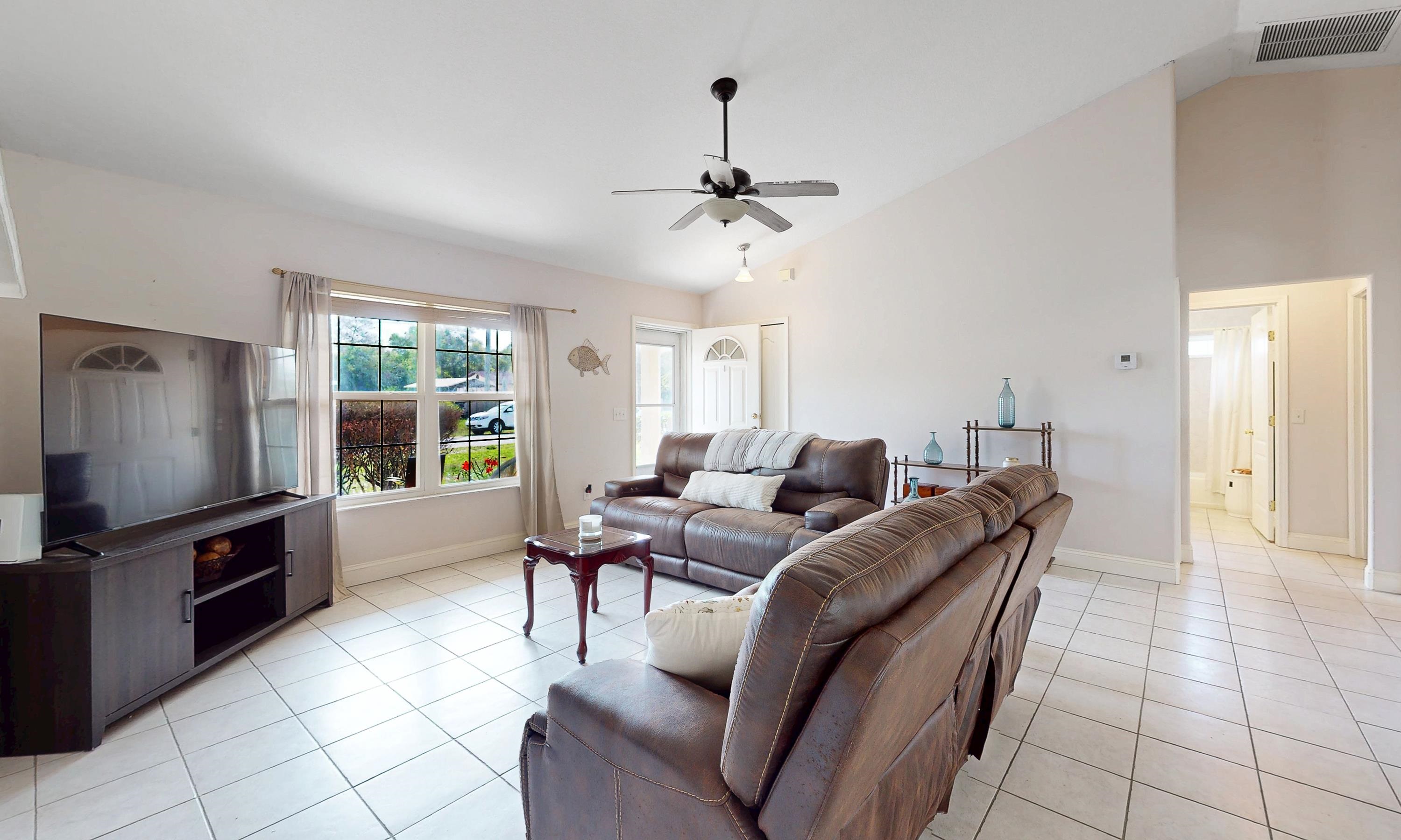 330 Segovia Road St. Augustine, FL 32086 - Photo 7 of 52 a living room with furniture and a flat screen tv
