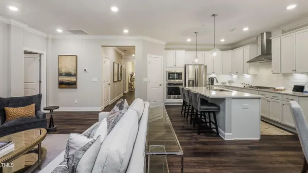 a kitchen with a sink appliances and cabinets