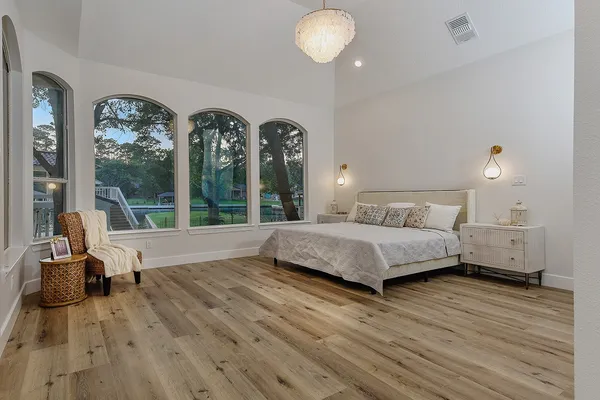 a view of a room with wooden floor