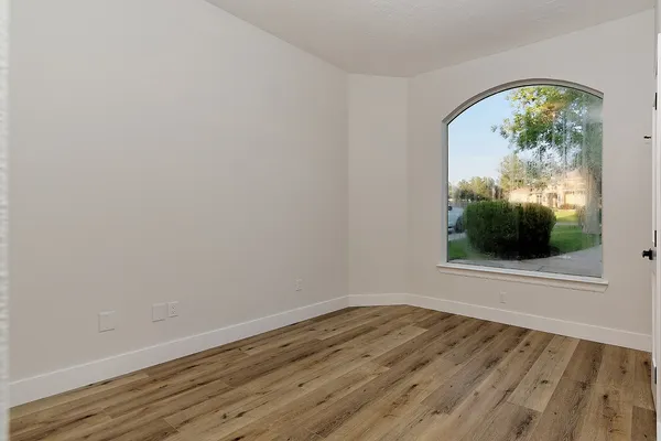 a view of a house with yard and sitting area