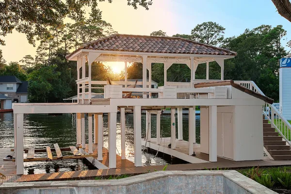 a view of a house with a yard and balcony