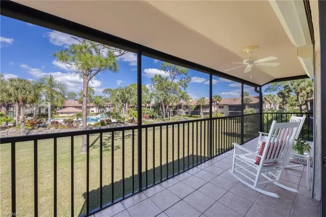 a view of a chair and tables in the balcony