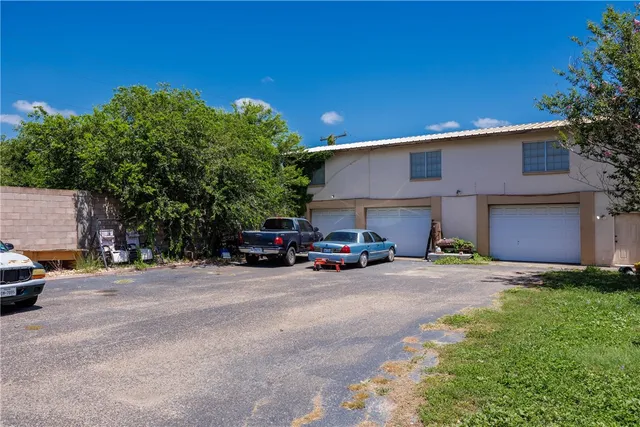 a view of a fire pit with a big yard