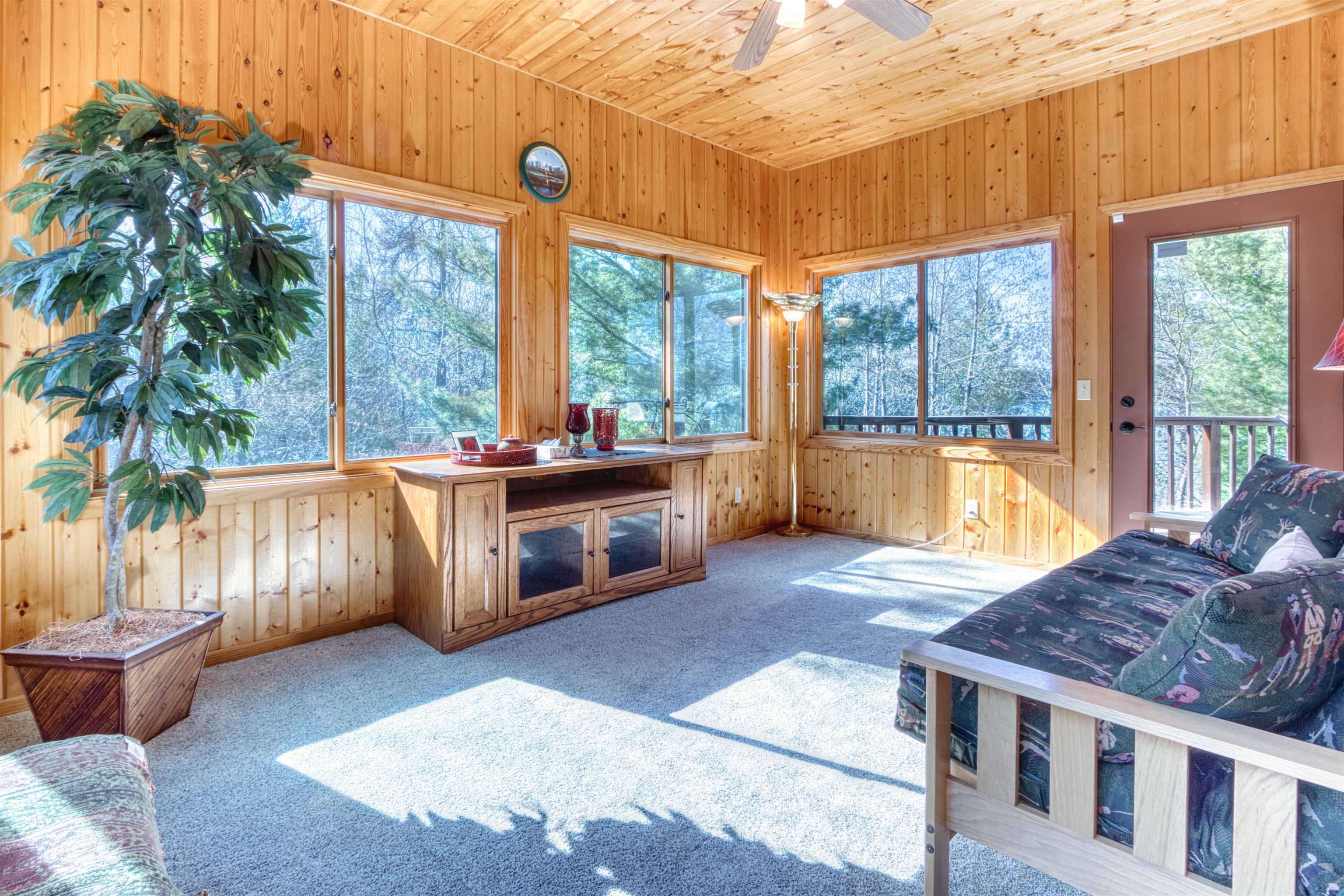14366 North One Mile Road Minong, WI 54859 - Photo 20 of 40 Sunroom with wooden ceiling, wood walls, and carpet