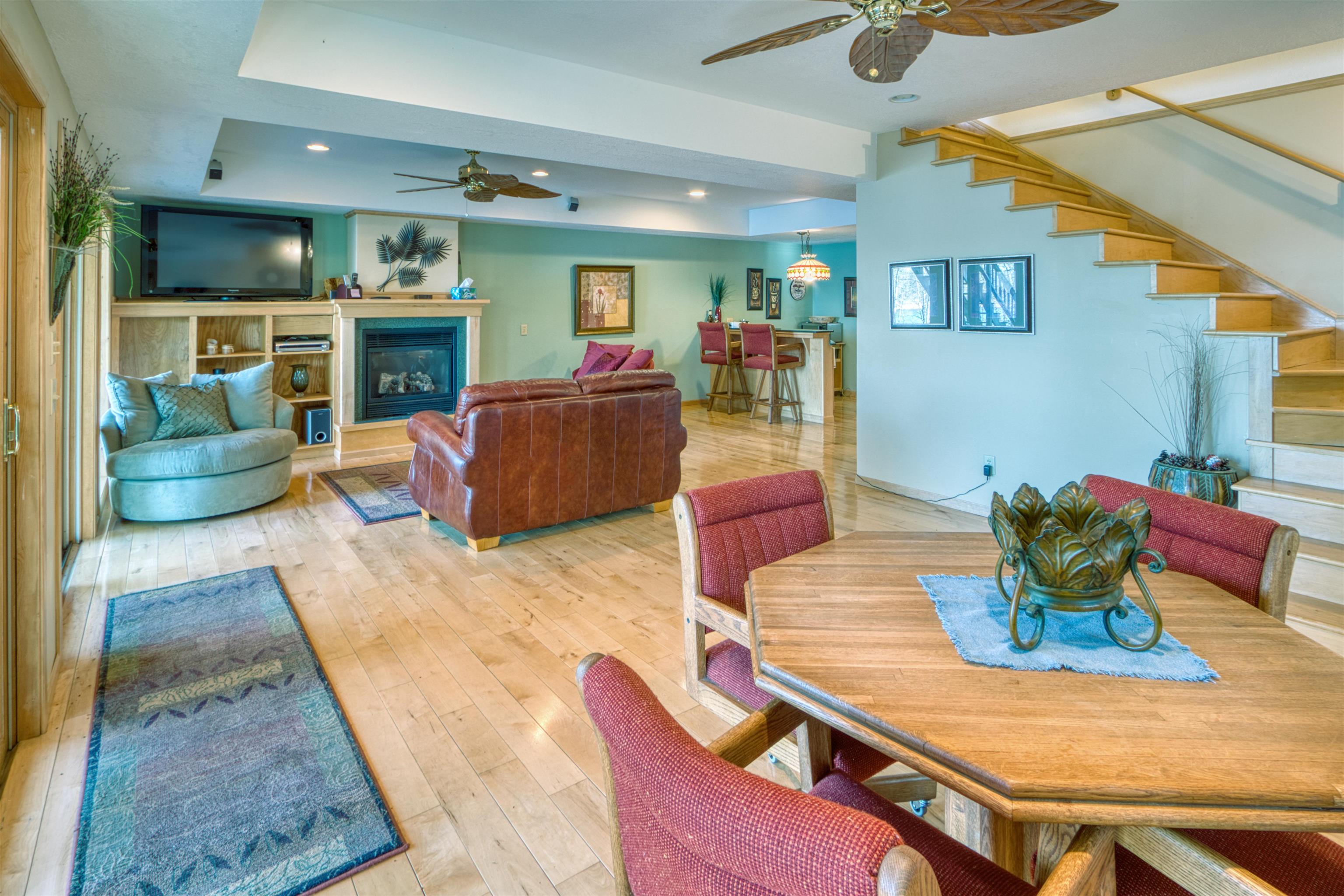 14366 North One Mile Road Minong, WI 54859 - Photo 34 of 40 Dining space featuring hardwood / wood-style flooring, a ceiling fan, stairway, and recessed lighting