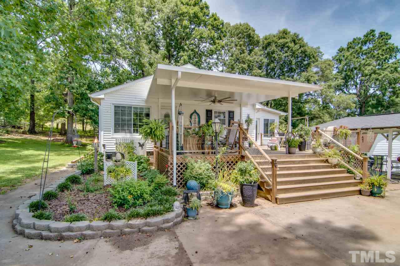 10814 Wilkins Road Bahama, NC 27503 - Photo 2 of 23 Large covered & open deck area to enjoy the seasons of NC....LARGE ceiling fan to keep the breezes moving!