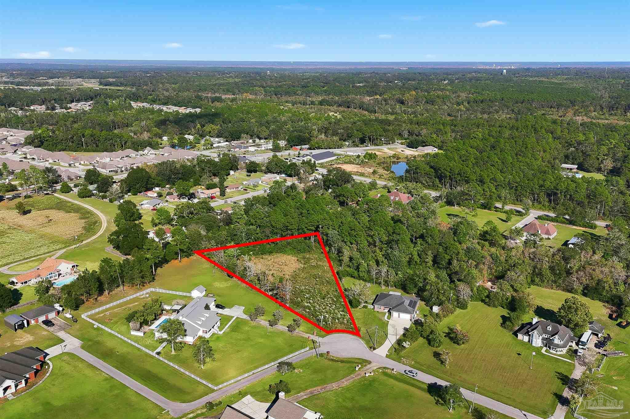 1950 Meander Circle Cantonment, FL 32533 - Photo 2 of 7 an aerial view of residential houses with outdoor space