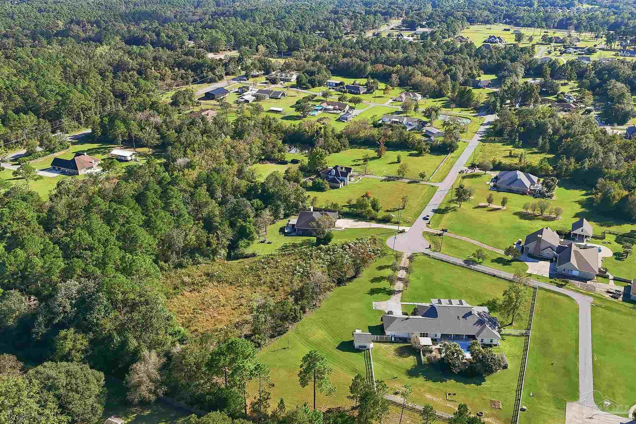 1950 Meander Circle Cantonment, FL 32533 - Photo 4 of 7 an aerial view of residential houses with outdoor space