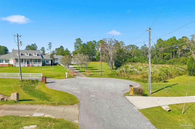 a view of a swimming pool with a yard