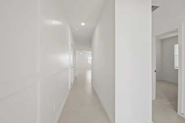 a view of a hallway with a door