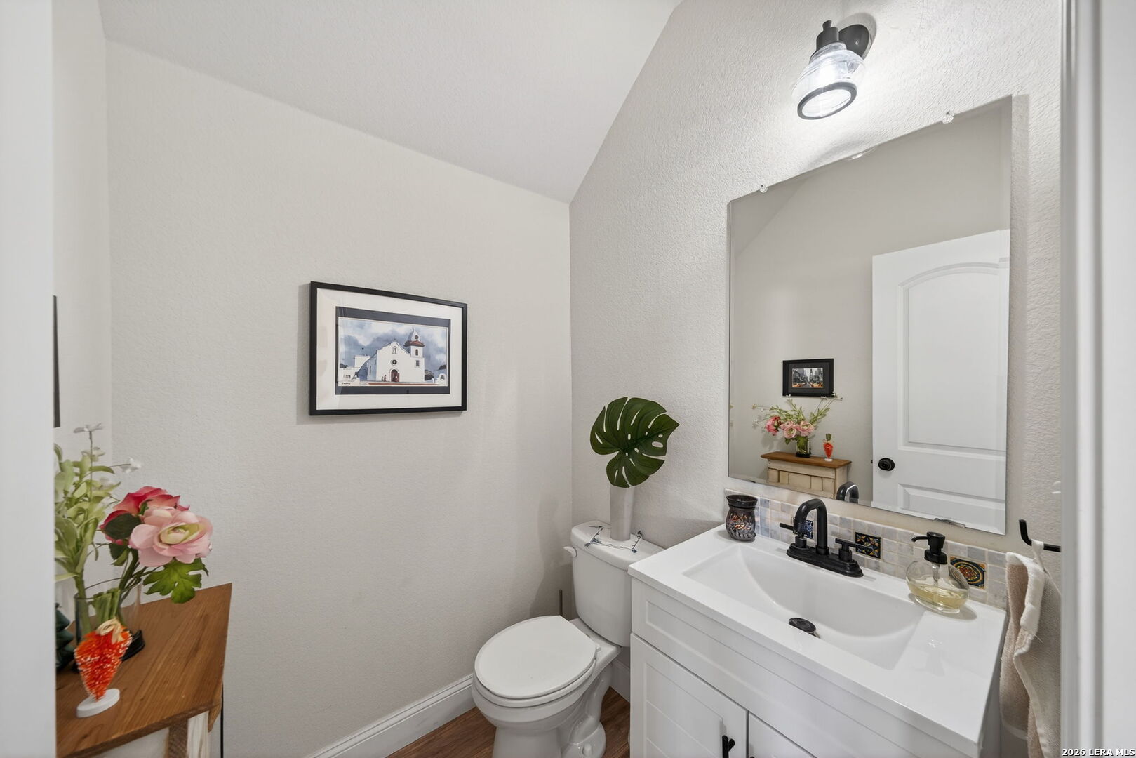 613 Whitman Avenue Georgetown, TX 78626 - Photo 13 of 24 a bathroom with a sink mirror vanity and toilet