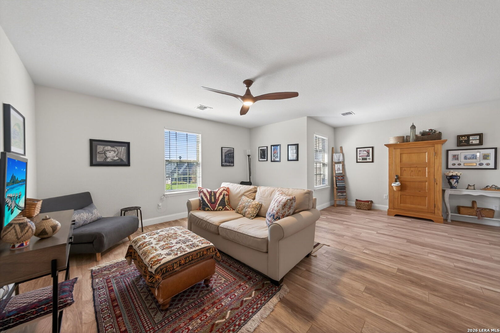 613 Whitman Avenue Georgetown, TX 78626 - Photo 15 of 24 a living room with furniture and a wooden floor