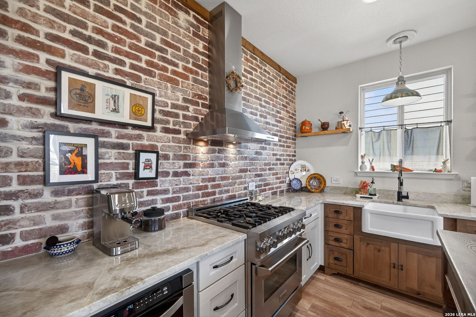 613 Whitman Avenue Georgetown, TX 78626 - Photo 8 of 24 a kitchen with stainless steel appliances granite countertop a stove and a sink