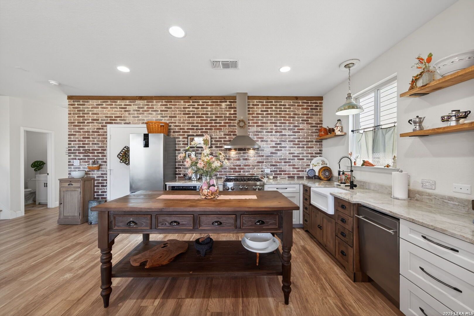613 Whitman Avenue Georgetown, TX 78626 - Photo 9 of 24 a kitchen with a table chairs stove and cabinets