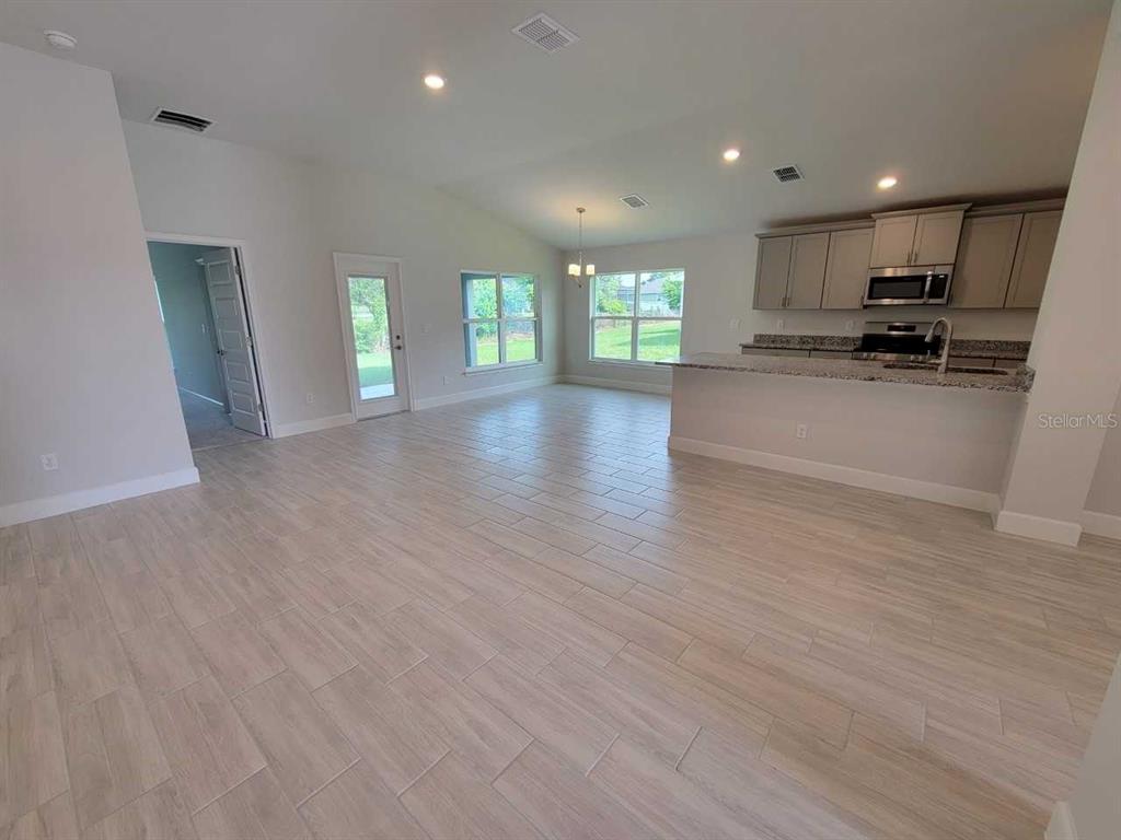 4525 Southwest 91st Ln Road Ocala, FL 34476 - Photo 4 of 20 a view of a kitchen with a sink and a window