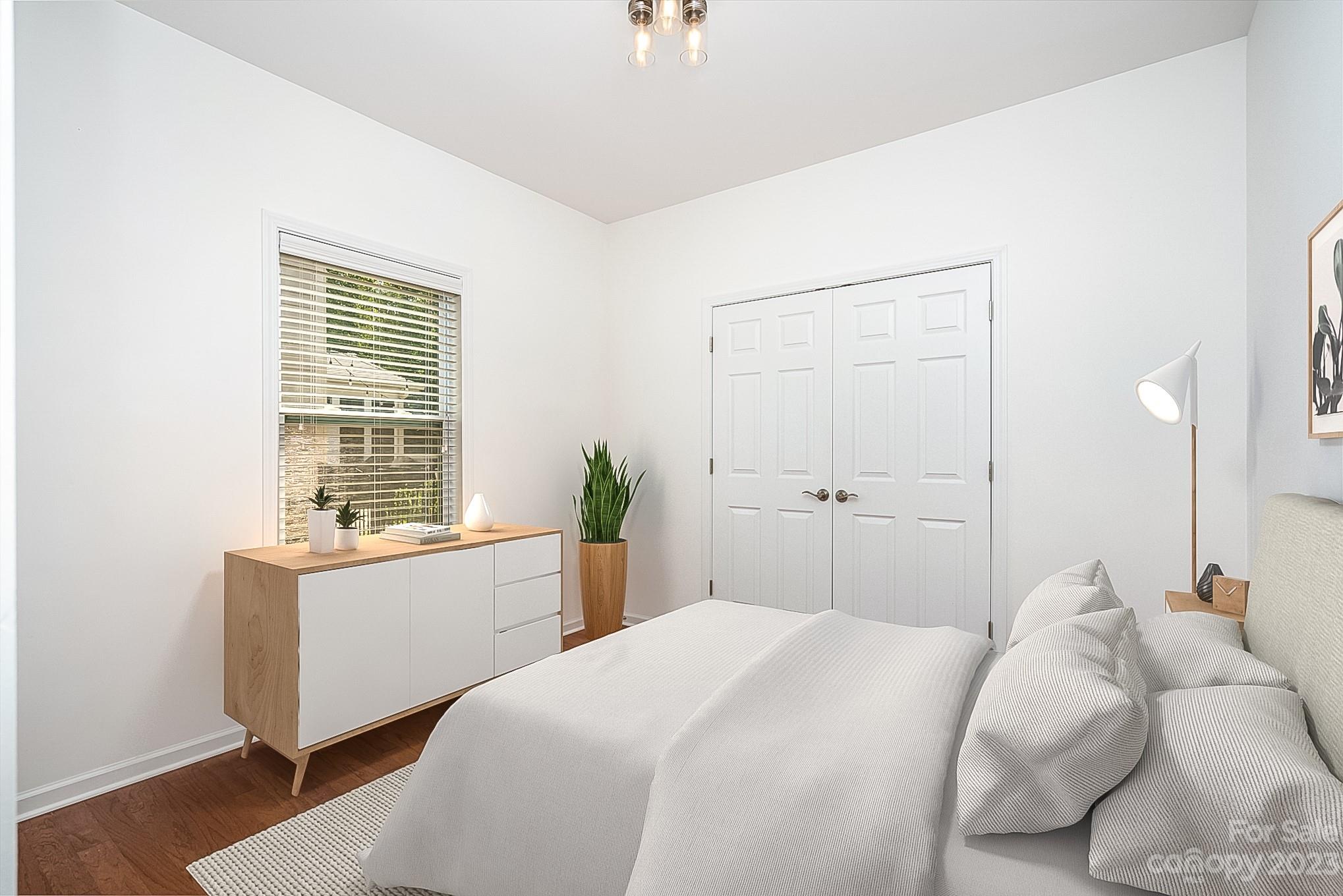 2185 Bluebell Way Tega Cay, SC 29708 - Photo 20 of 45 a bedroom with a bed and a window