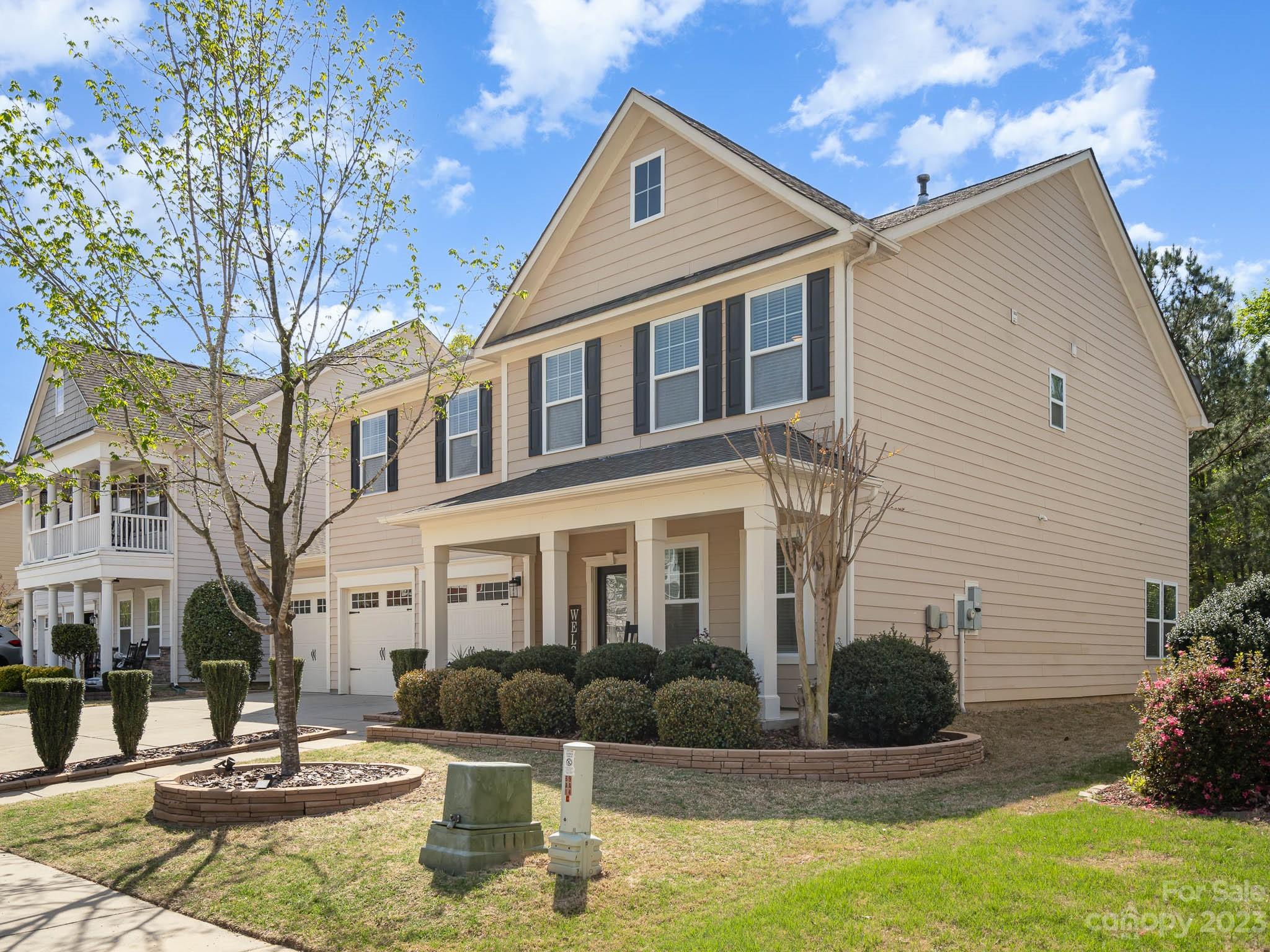 2185 Bluebell Way Tega Cay, SC 29708 - Photo 2 of 45 a front view of a house with garden