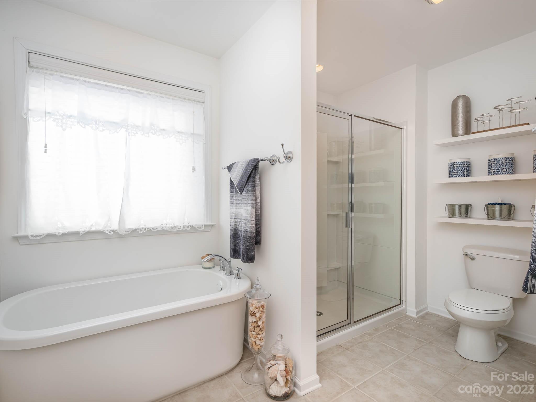 2185 Bluebell Way Tega Cay, SC 29708 - Photo 25 of 45 a bathroom with a toilet and a shower