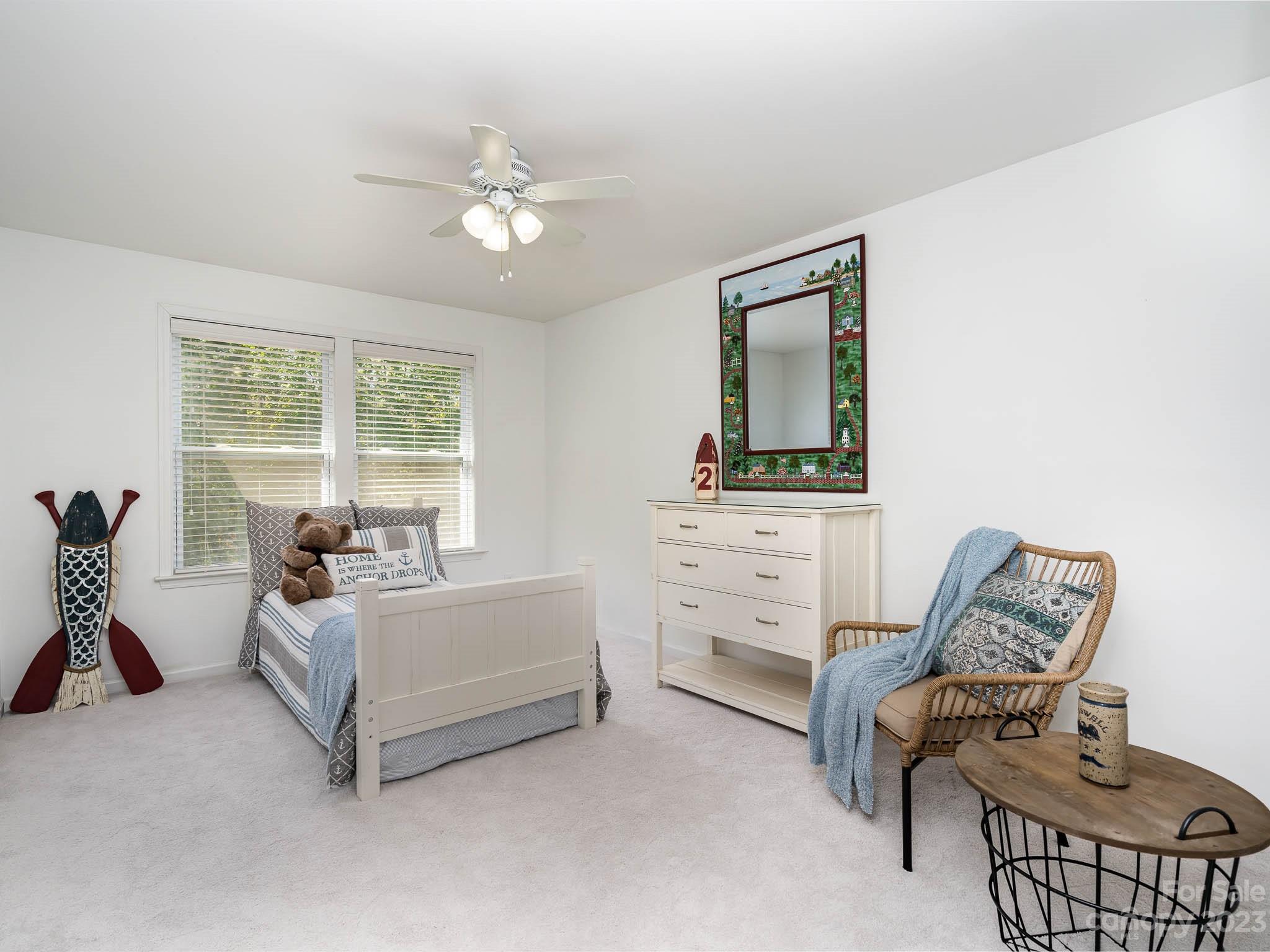 2185 Bluebell Way Tega Cay, SC 29708 - Photo 29 of 45 a bedroom with furniture and windows