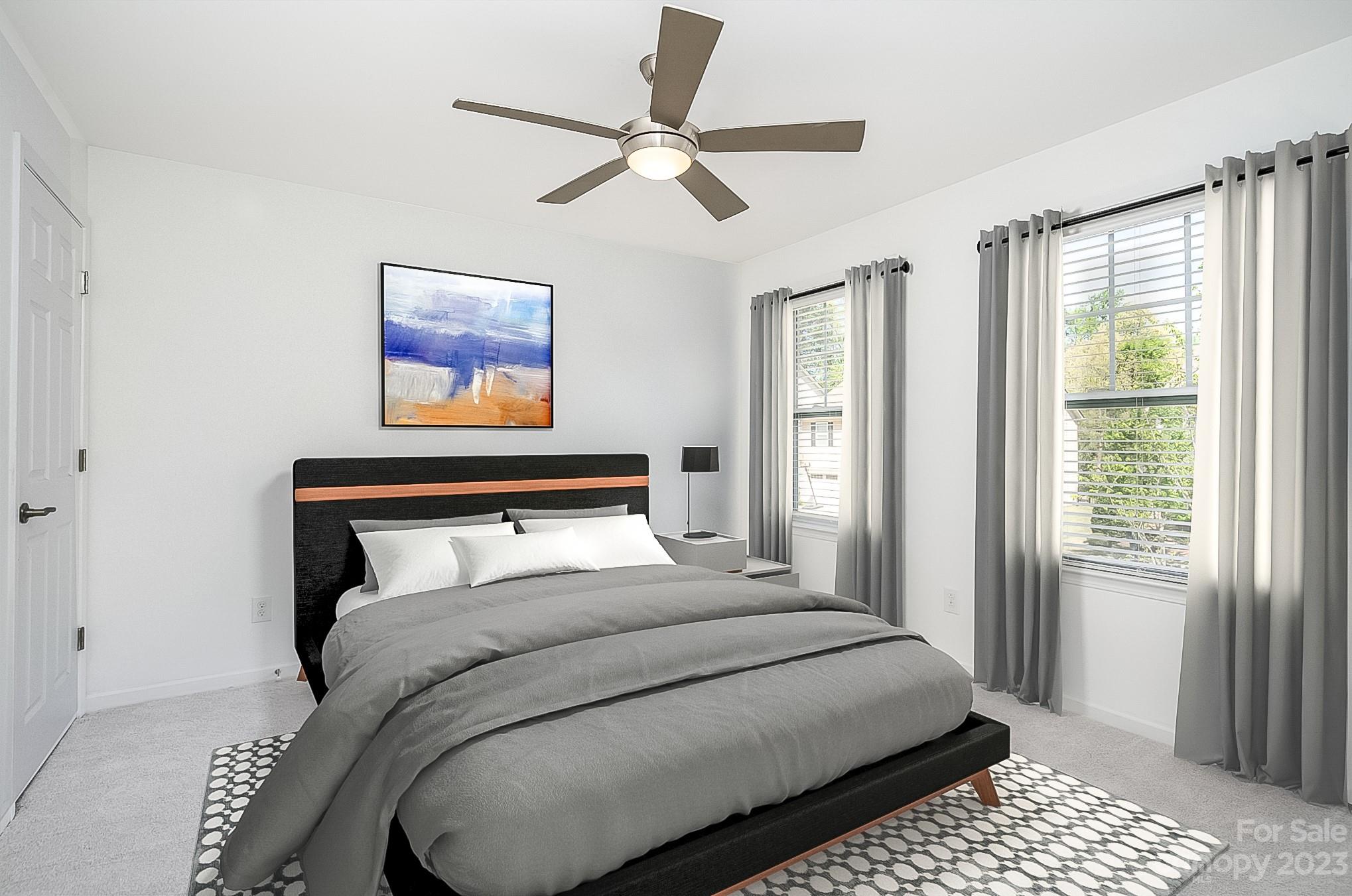 2185 Bluebell Way Tega Cay, SC 29708 - Photo 30 of 45 a bedroom with a large bed and a window