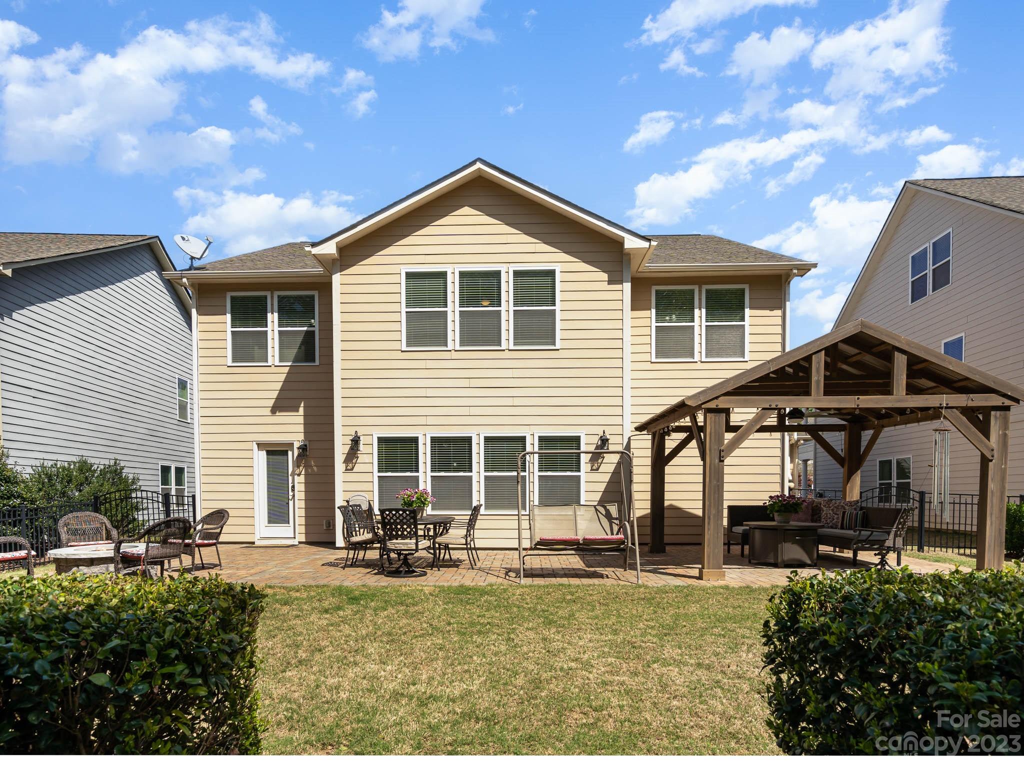 2185 Bluebell Way Tega Cay, SC 29708 - Photo 33 of 45 a front view of a house with a yard