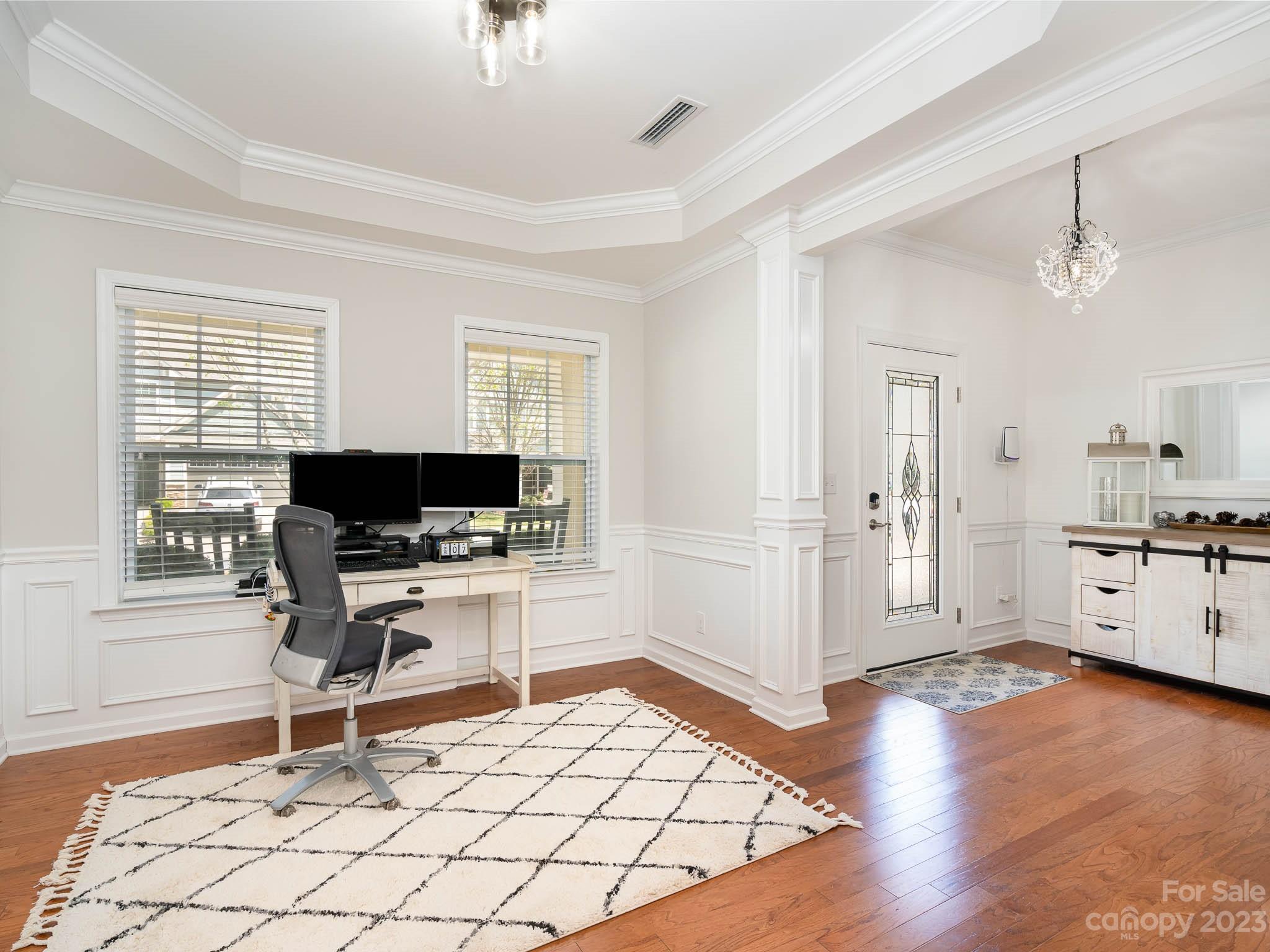 2185 Bluebell Way Tega Cay, SC 29708 - Photo 7 of 45 a workspace with wooden floor and furniture