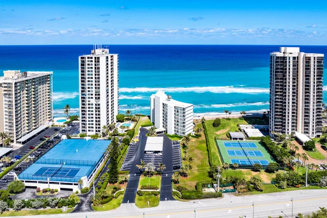 a view of swimming pool with lawn chairs