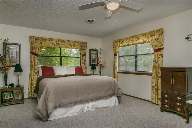 a view of a livingroom with furniture and windows