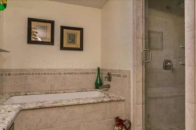 a bedroom with a bed cabinets and window