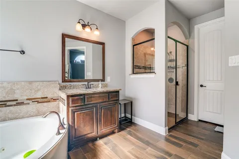 a view of a bathroom with a tub and a sink
