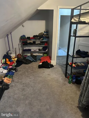 a bedroom with furniture and a gym equipment