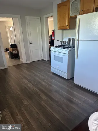 a kitchen with stainless steel appliances granite countertop a stove and a refrigerator