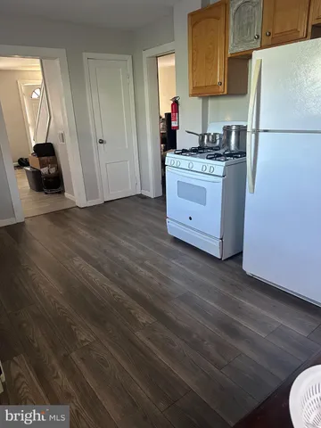 a kitchen with stainless steel appliances granite countertop a stove and a refrigerator