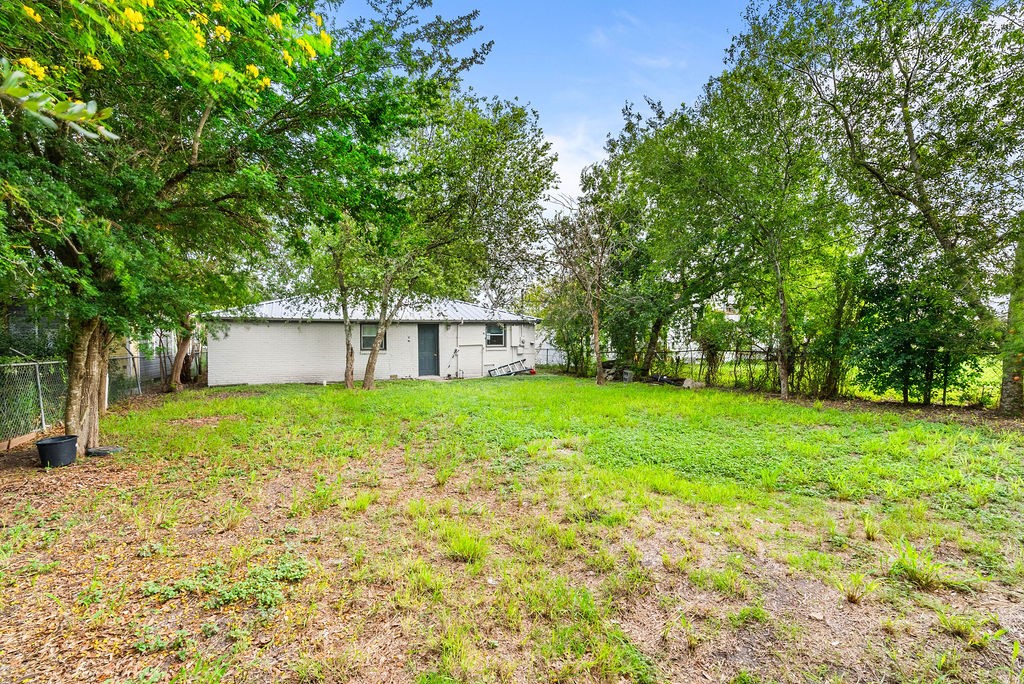 647 West Main Avenue Robstown, TX 78380 - Photo 15 of 16 a view of a house with backyard and a tree