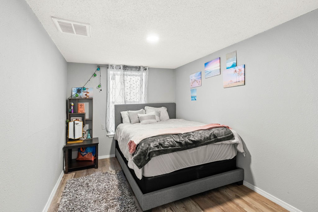 647 West Main Avenue Robstown, TX 78380 - Photo 8 of 16 a bedroom with a bed and dresser