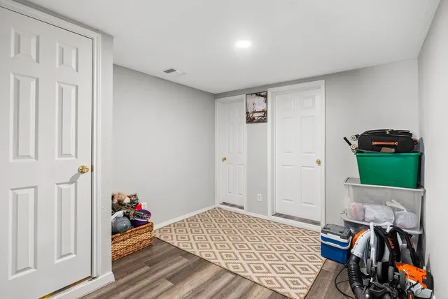 a room that has a bed and a chair in it