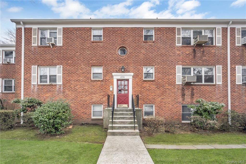 2246 Palmer Avenue, Unit 3E New Rochelle, NY 10801 - Photo 1 of 14 a front view of a house with garden