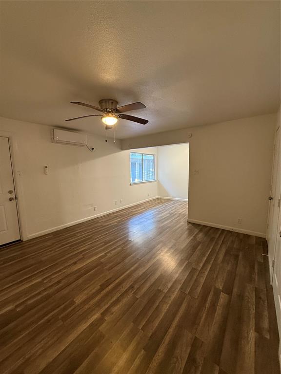 2701 Hemphill Street Fort Worth, TX 76110 - Photo 6 of 11 a view of an empty room and wooden floor