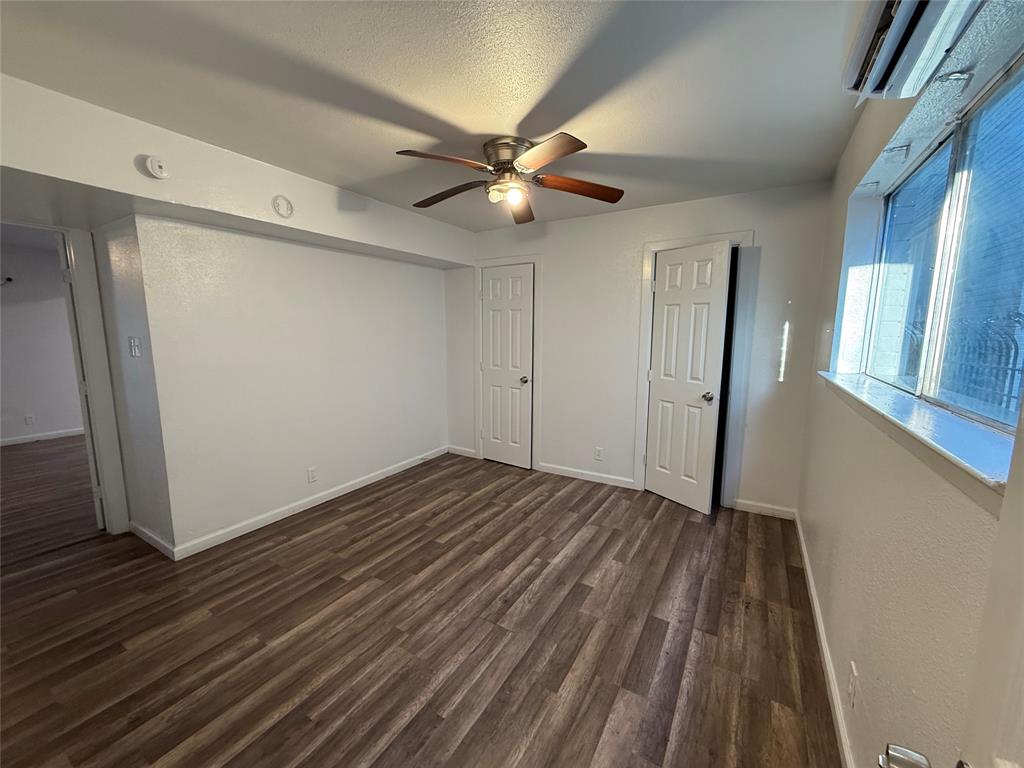 2701 Hemphill Street Fort Worth, TX 76110 - Photo 8 of 11 a view of empty room with wooden floor