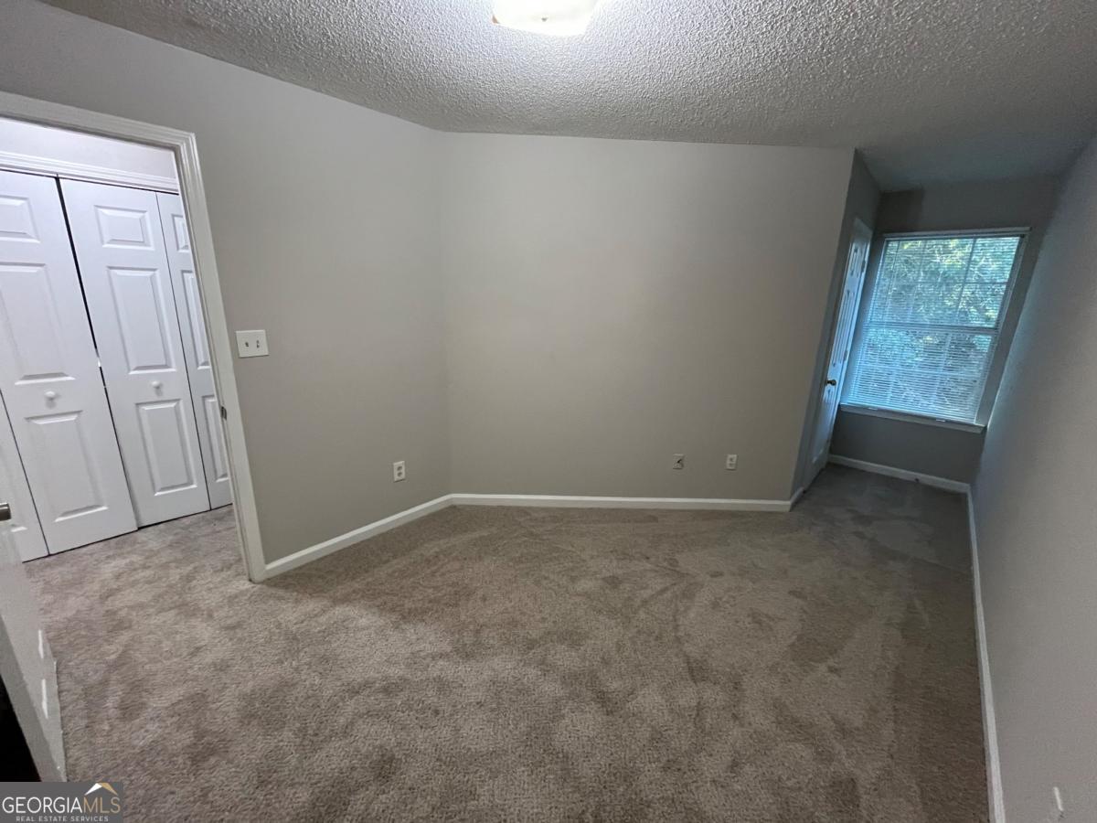 3604 Ginnis Road, Unit 1 Atlanta, GA 30331 - Photo 13 of 15 an empty room with windows