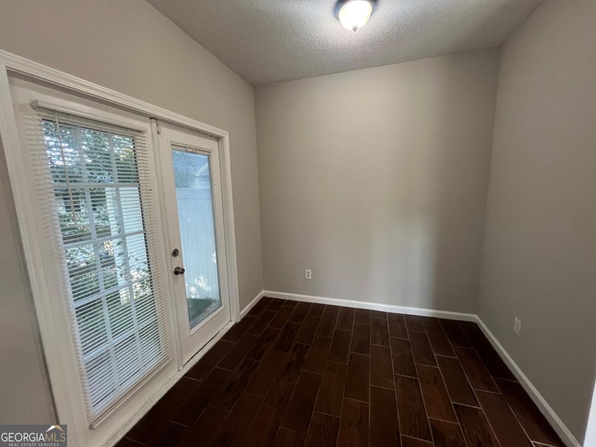 3604 Ginnis Road, Unit 1 Atlanta, GA 30331 - Photo 6 of 15 a view of a room with wooden floor and windows