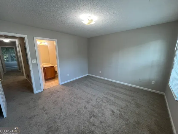 an empty room with a bathroom