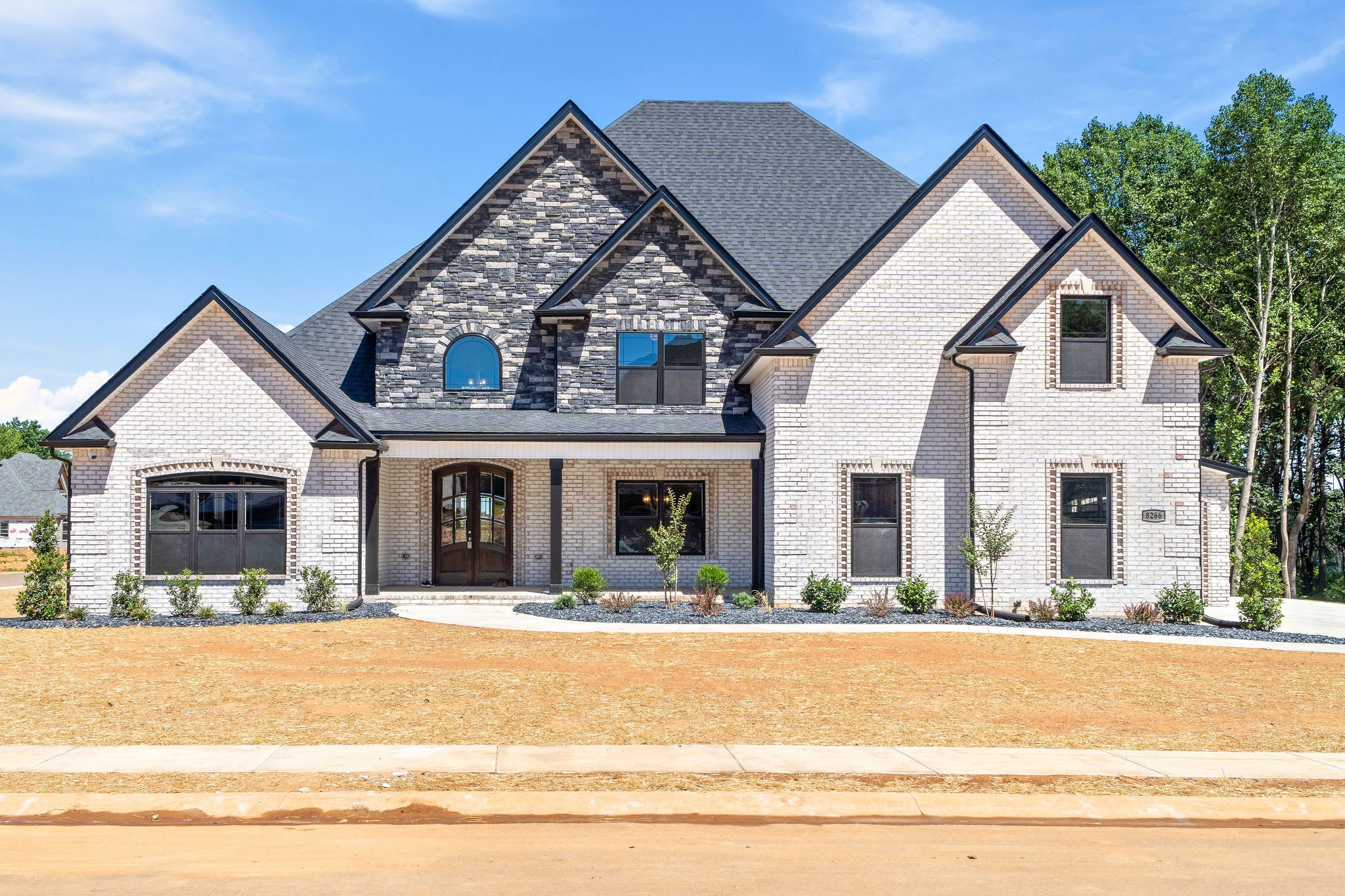 a view of house with outdoor space and swimming pool