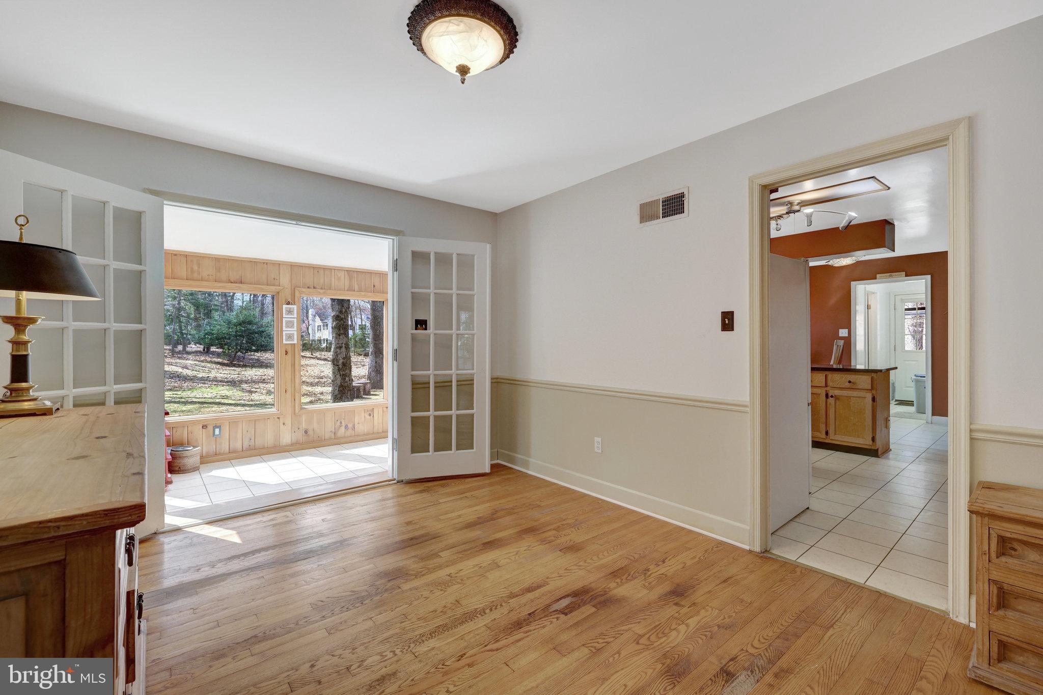 11332 Vale Road Oakton, VA 22124 - Photo 14 of 52 a view of empty room with wooden floor and fan