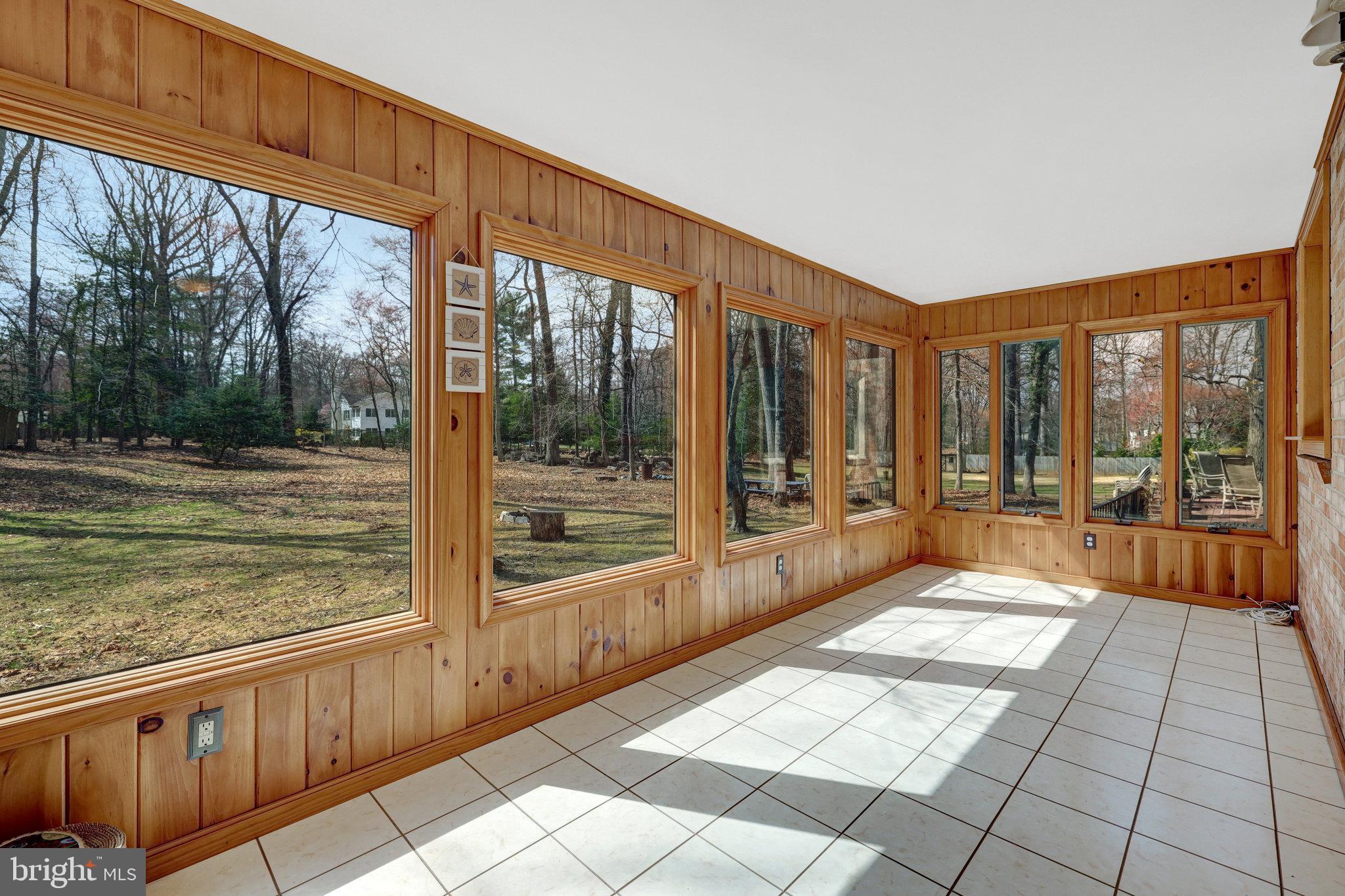 11332 Vale Road Oakton, VA 22124 - Photo 16 of 52 a view of a large room with wooden floor and outdoor space