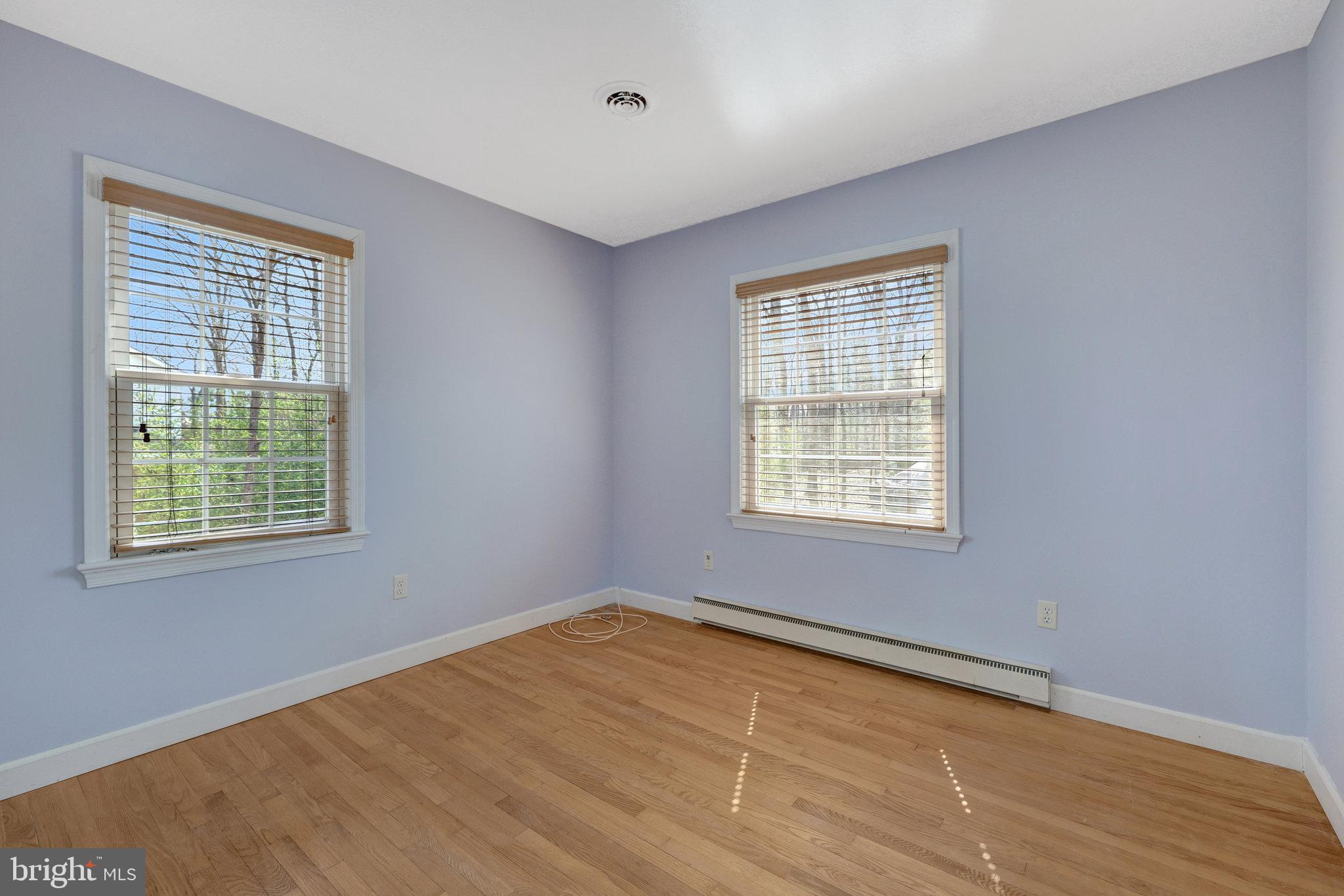 11332 Vale Road Oakton, VA 22124 - Photo 28 of 52 a view of an empty room with wooden floor and a window