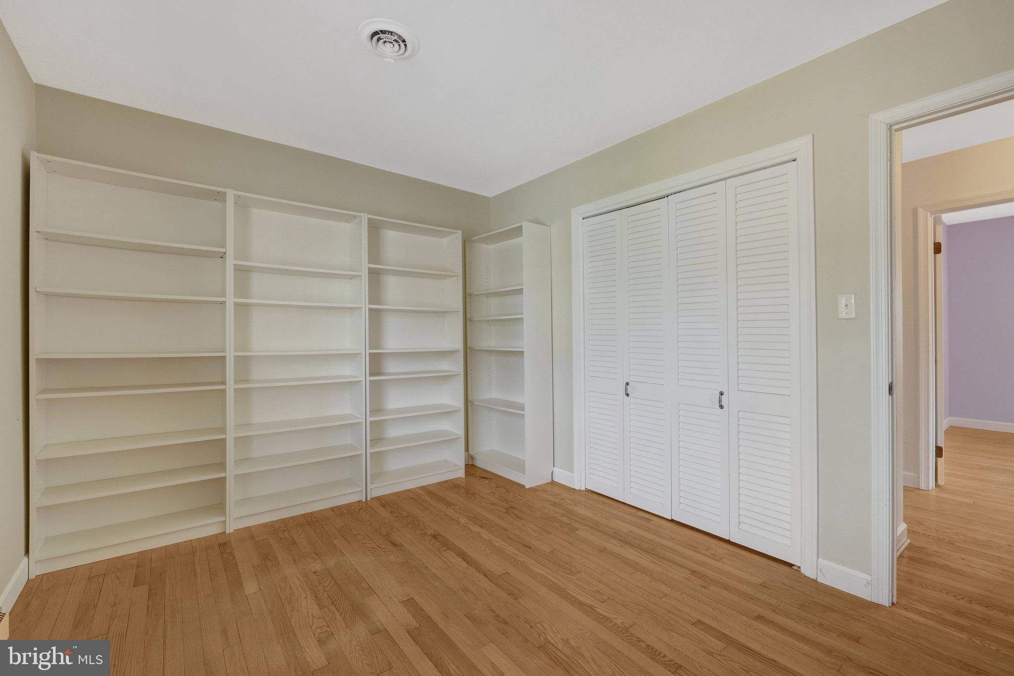 11332 Vale Road Oakton, VA 22124 - Photo 33 of 52 a view of empty room with wooden floor and cabinet