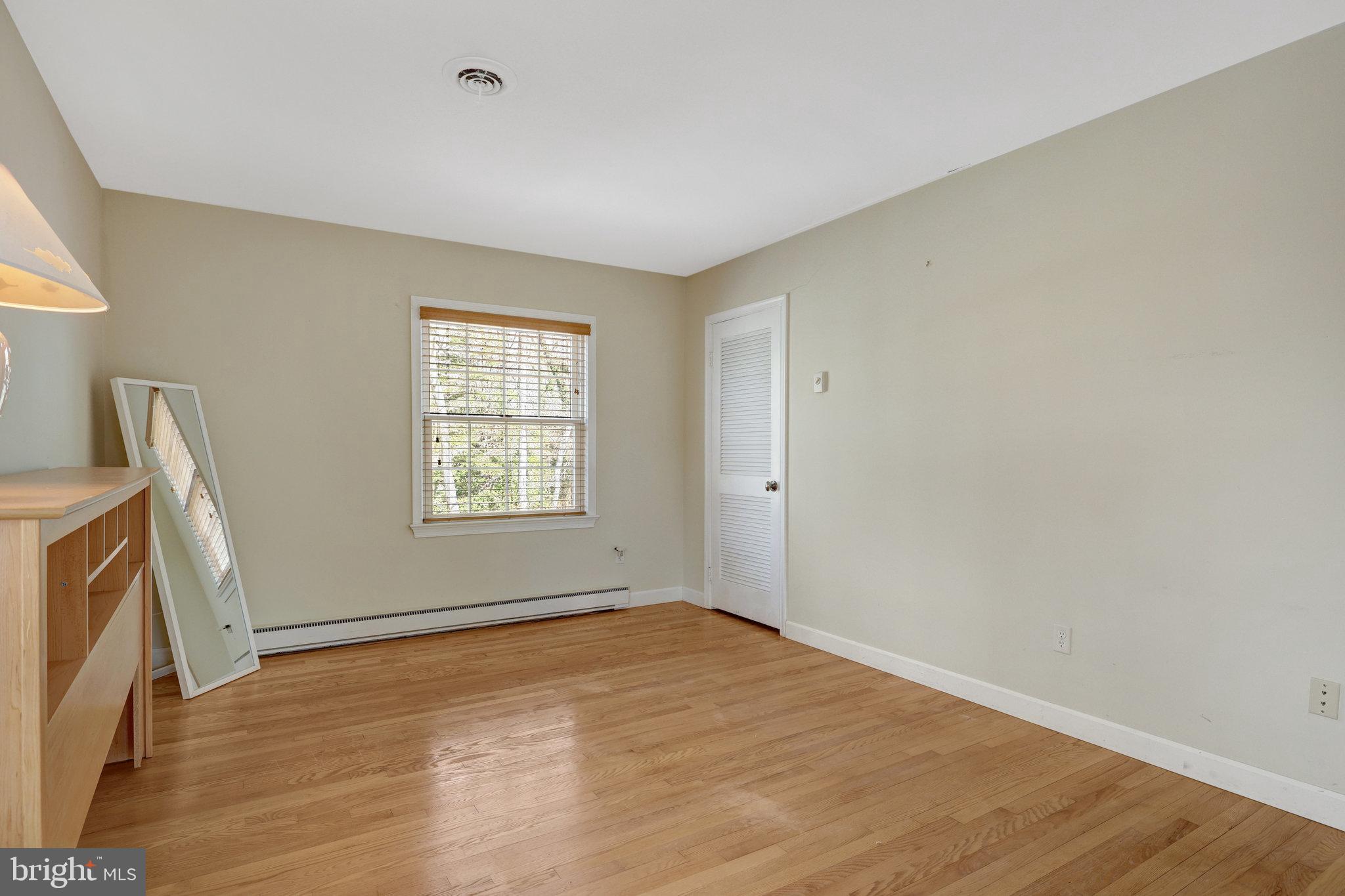 11332 Vale Road Oakton, VA 22124 - Photo 36 of 52 a view of empty room with window and wooden floor